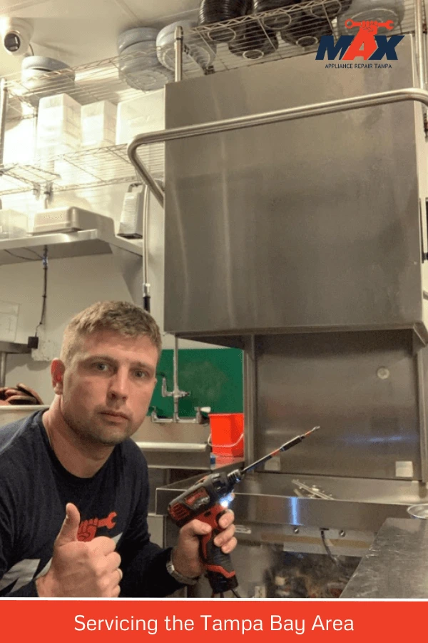 technician working on commercial dishwasher repair
