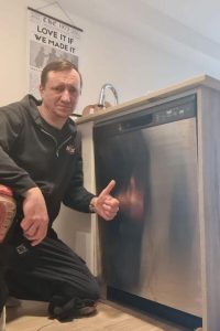 professional fixing broken dishwasher
