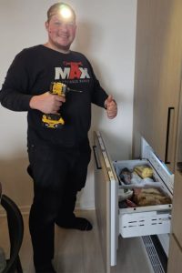 fridge being repaired by technician