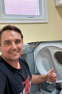 technician disassembling broken dry for repair