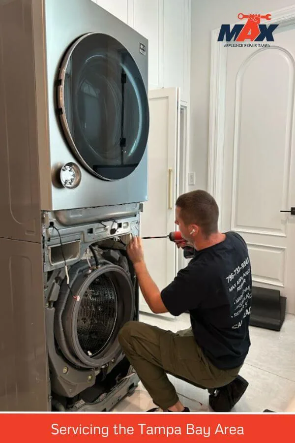 Max Appliance Repair technician servicing a stacked laundry center
