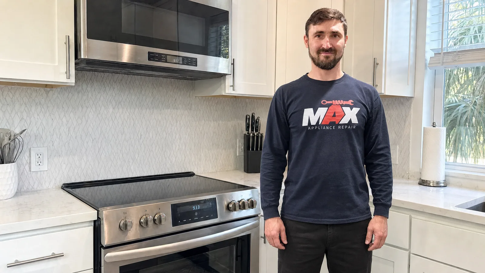 Max Appliance Repair Tampa technician standing naturally beside a kitchen range